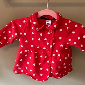 Red jacket with white hearts